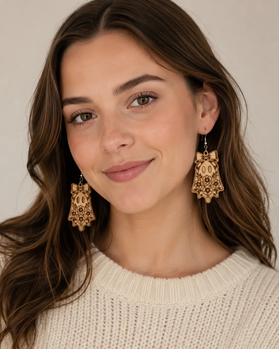 Floral ghost wooden Halloween earrings being worn